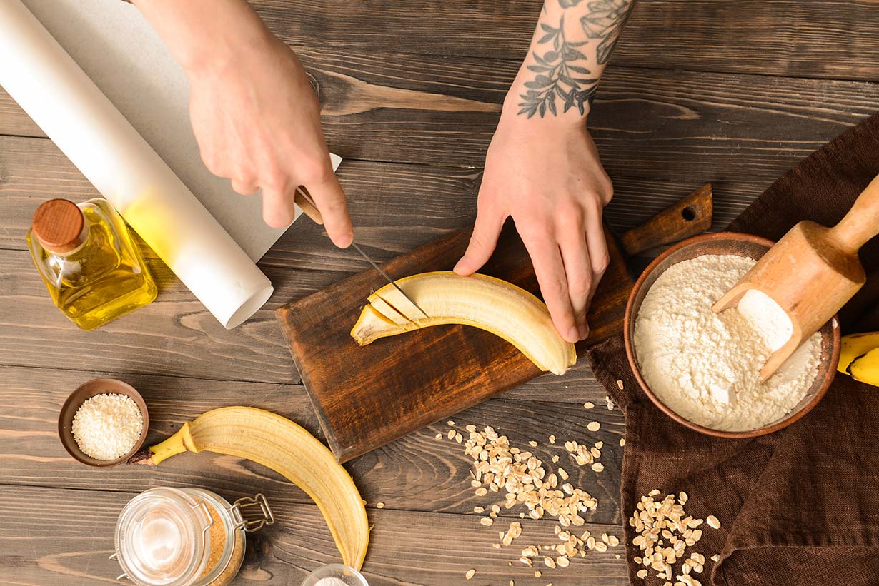 Person baking with bananas